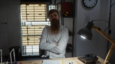 Bearded man with arms crossed stands in a dimly lit detective's office with filing cabinets, clock, and desk. clipart
