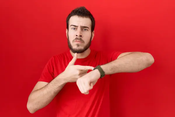 Young Hispanic Man Wearing Casual Red Shirt Hurry Pointing Watch — Stock Photo, Image