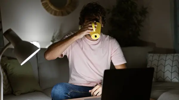 Young Hispanic Man Drinking Coffee Working Late Cozy Home Interior — Stock Photo, Image