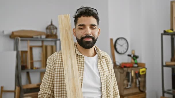 Smiling Young Man Beard Holding Lumber Neat Carpentry Workshop Embodying — Stok Video
