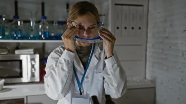 Caucasian Woman Blonde Hair Wearing Protective Goggles Lab Coat Examines — Stock Video