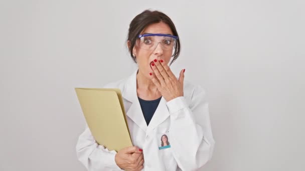 Shocked Mature Hispanic Woman Safety Glasses Covering Mouth Hand Holding — Stock Video