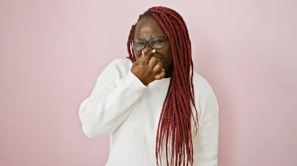 Woman Braids Expresses Disgust Pink Background Covering Her Nose Her — Stock Photo, Image