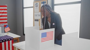 African american woman with braids voting at a us electoral college polling station, adorned with flags. clipart