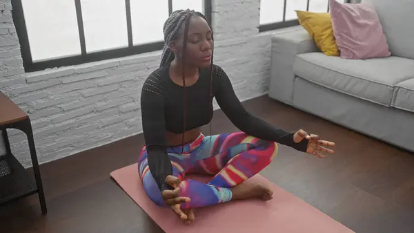 Peaceful African American Woman Meditates Yoga Mat Modern Living Room — Stock Photo, Image