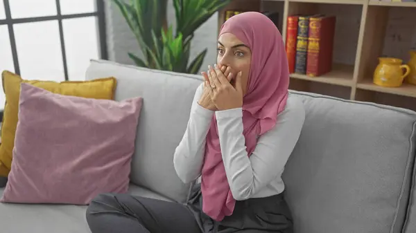 Surprised Young Woman Wearing Hijab Sitting Couch Indoors Colorful Pillows — Stock Photo, Image