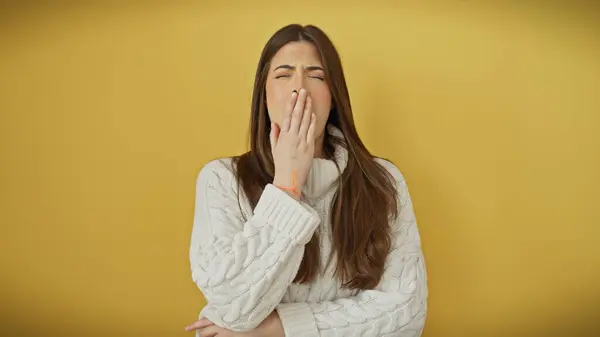 Young Hispanic Woman White Sweater Yawning Yellow Background Royalty Free Stock Photos