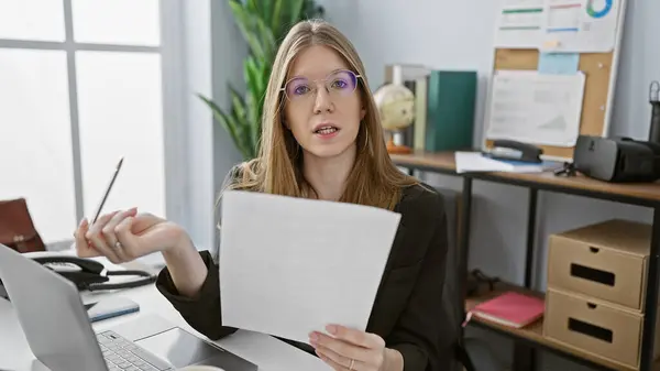 Confident Young Adult Caucasian Businesswoman Analyzing Document Modern Office Interior Royalty Free Stock Images