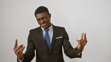 Handsome african american man in suit, rocking out with devil sign hand gesture, an expression of heavy music fun. stand-alone star on isolated white background.