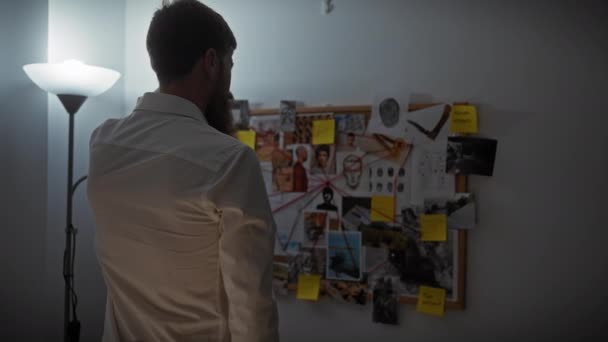Rear View Bearded Man Analyzing Crime Board Office Setting — Stock Video