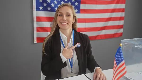 Smiling Young Caucasian Woman Points Her Voted Sticker American Indoor Fotografie de stoc