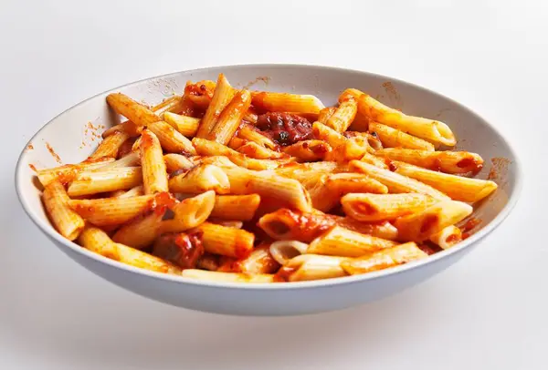 Dish Italian Penne Pasta Coated Tomato Sauce Served White Background fotografii de stoc fără drepturi de autor