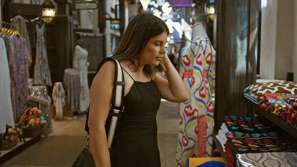 stock image A thoughtful woman shopping in the traditional arabian ambience of souk madinat jumeirah in dubai.