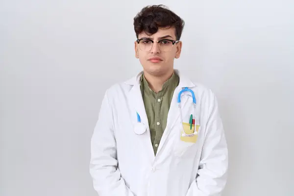 stock image Young non binary man wearing doctor uniform and stethoscope skeptic and nervous, frowning upset because of problem. negative person. 