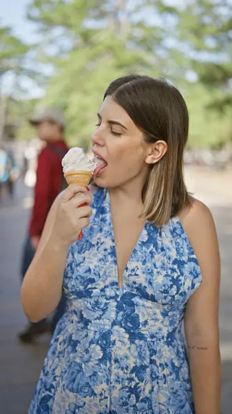 stock image Summertime delight, beautiful hispanic woman enjoying delicious ice cream cone on a sunny day in nara, japan's luscious park, her cheerful smile reflecting holiday fun and outdoor adventures