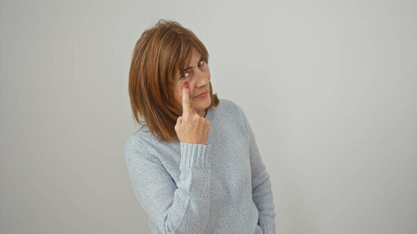Mature Woman Pointing Her Eye White Background Conveying Message Thoughtful Stock Picture