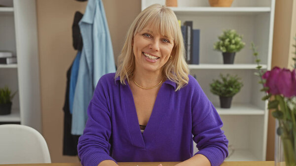 Smiling Caucasian Woman Purple Sweater Sits Table Cozy Home Interior Stock Picture