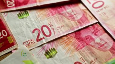İsrail 'in 20 şekel banknotları, karmaşık güvenlik özellikleri ve canlı renkleri gösteren yakın çekim görüntüsüne yayıldı.