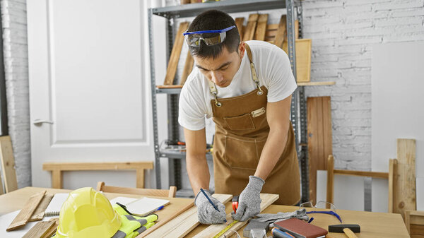 Hispanic carpenter measuring wood in a well-equipped workshop, exemplifying skilled manual labor.