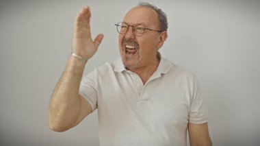 Bald shouting senior man with glasses against a white background expressing strong emotion or calling out. clipart