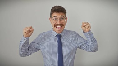 Excited hispanic man in shirt and tie with glasses and moustache celebrating on a white background clipart