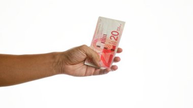 İzole edilmiş beyaz arkaplan üzerinde el ele tutuşan İsrail 'in yeni şekelleri, mali işlemleri veya döviz kurlarını betimliyor