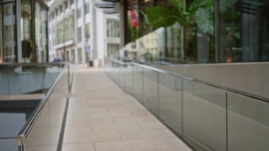 Blurred urban landscape of a luxury monaco street with defocused glass architecture and bokeh effect, capturing the vibrant outdoors and modern surroundings. clipart