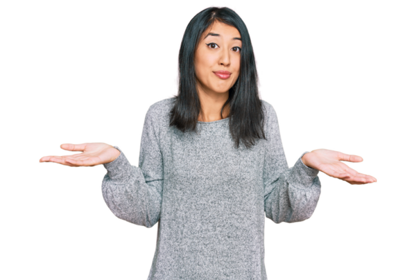 portrait of beautiful young woman shrugging shoulders on transparent background          