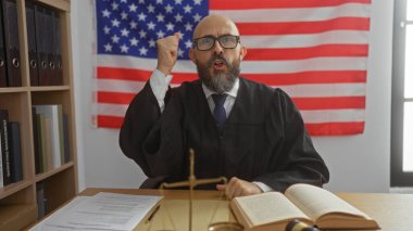 Hispanic man judge in courtroom shouting in anger, wearing glasses and judicial robe, with the american flag in the background. clipart