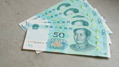 Çin banknotlarında, Çin 'deki Çin Yuan para biriminin finansal işlemler ve ekonomik değişimler için kullanıldığı somut bir yüzeyde mao zedong yer alıyor..