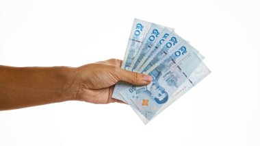 Tayland baht para birimi beyaz bir arkaplan karşısında izole, Tayland para ayrıntıları ve finansal konsept sergileniyor.