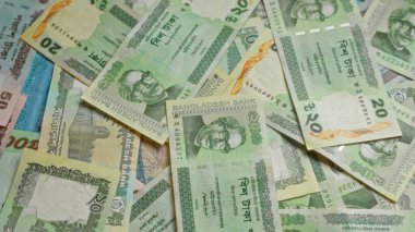 Bangladeshi taka banknotları çeşitli banknotlar ve Bangladeş 'in para biriminden canlı tasarımlar sergileniyor..