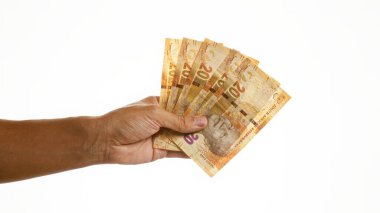 El ele tutuşan Güney Afrikalılar izole edilmiş beyaz arka plana karşı Mandela 'nın portresi belirgin para biriminde sergilenmektedir