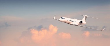 Beyaz modern lüks işletme jeti bulutların üzerinde uçuyor.