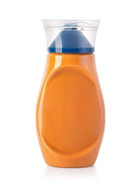 orange squeeze plastic bottle for mustard isolated on white background with clipping path