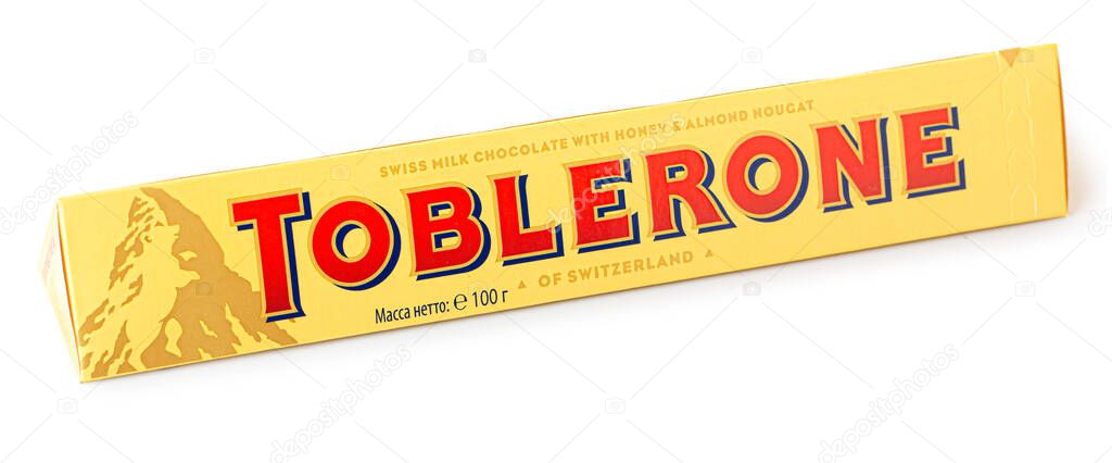 Anapa, Russia, February 01, 2023: Toblerone Bars Swiss Milk Chocolate with Honey and Almond Nougat of Switzerland, on white background.