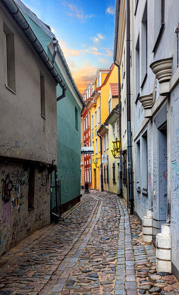 LATVIA, RIGA, 28 July 2023: Narrow medieval street in old Riga, Latvia. In 2014, Riga city is the European capital of culture