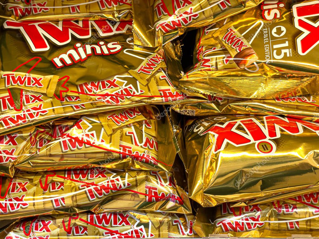 Roma, Italy, 20 December 2023: Close-up of Twix minis candy bars on a shelf in a store in the Duty Free store at Rome Fiumicino Airport.