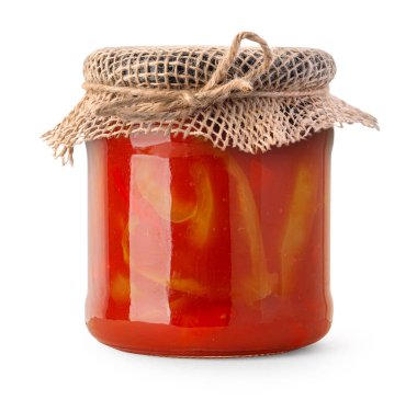 Bir kavanoz ev yapımı sebze yahnisi ve sade çuval bezi kapağı kesilmiş.