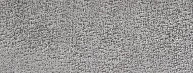 Arkaplan ve tasarım projeleri için uygun olan dokusu sergilenen sert beton bir duvarın yakın görüntüsü