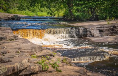 Mineral color display from water leaking from rock floor