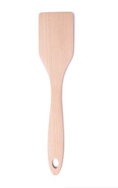 Wooden cookware in kitchen for mixing  on stovetop on white
