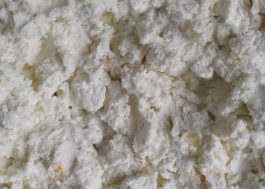 Süzme peynir arka planı. Süt kaymağı üst görünümü. Yakın çekim.