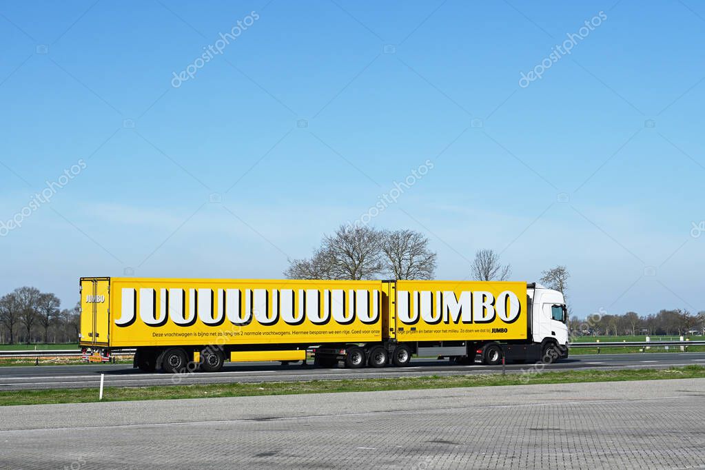 STAPHORST, NETHERLANDS - APRIL 2023: Large goods vehicle (LGV)  of the Dutch supermarket chain Jumbo driving on highway A28 on the way for the delivery of goods
