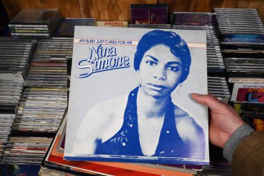 THE NETHERLANDS - FEBRUARY 2024: A 1982 released LP album, My baby just cares for me, by the American singer, songwriter, pianist, composer, arranger and civil rights activist Nina Simone, for sale at a collector's fair clipart