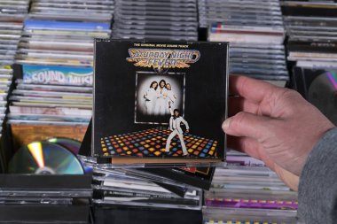 NETHERLANDS - MARCH 2024: CD: Saturday Night Fever: The Original Movie Sound Track, a 1977 released soundtrack album by the Bee Gees and various artists, for sale at a collector's fair