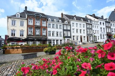 STAVELOT, BELGIUM - AUGUST 2023: Flowering plants on Place Saint Remacle, a cobbled square in the historical center of Stavelot a town in the Belgian Ardennes. clipart
