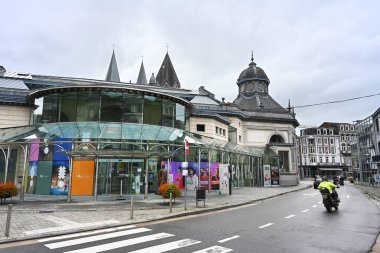 SPA, WALLONIA, BELGIUM - AUGUST 2023: Glass exhibition space extension to the historic Pouhon Pierre le Grand building clipart
