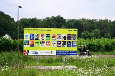 RHEDEN, NETHERLANDS - MAY 2024: Billboard Election posters for the European elections, voting for The European Parliament 2024 clipart
