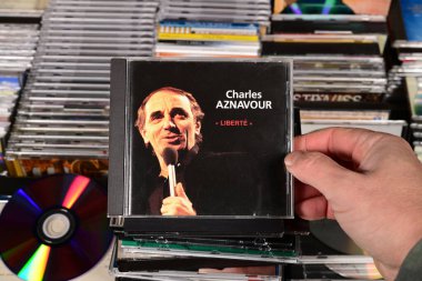 NETHERLANDS - JANUARY 2025: CD: Charles Aznavour - Liberte,  In1992 released compilation album by the French singer and actor of Armenian descent, for sale at a collector's fair clipart